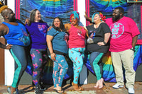 Your Rouge PHotography. Six diverse fat people stand laughing wearing Society of Fat Mermaids Shirts.